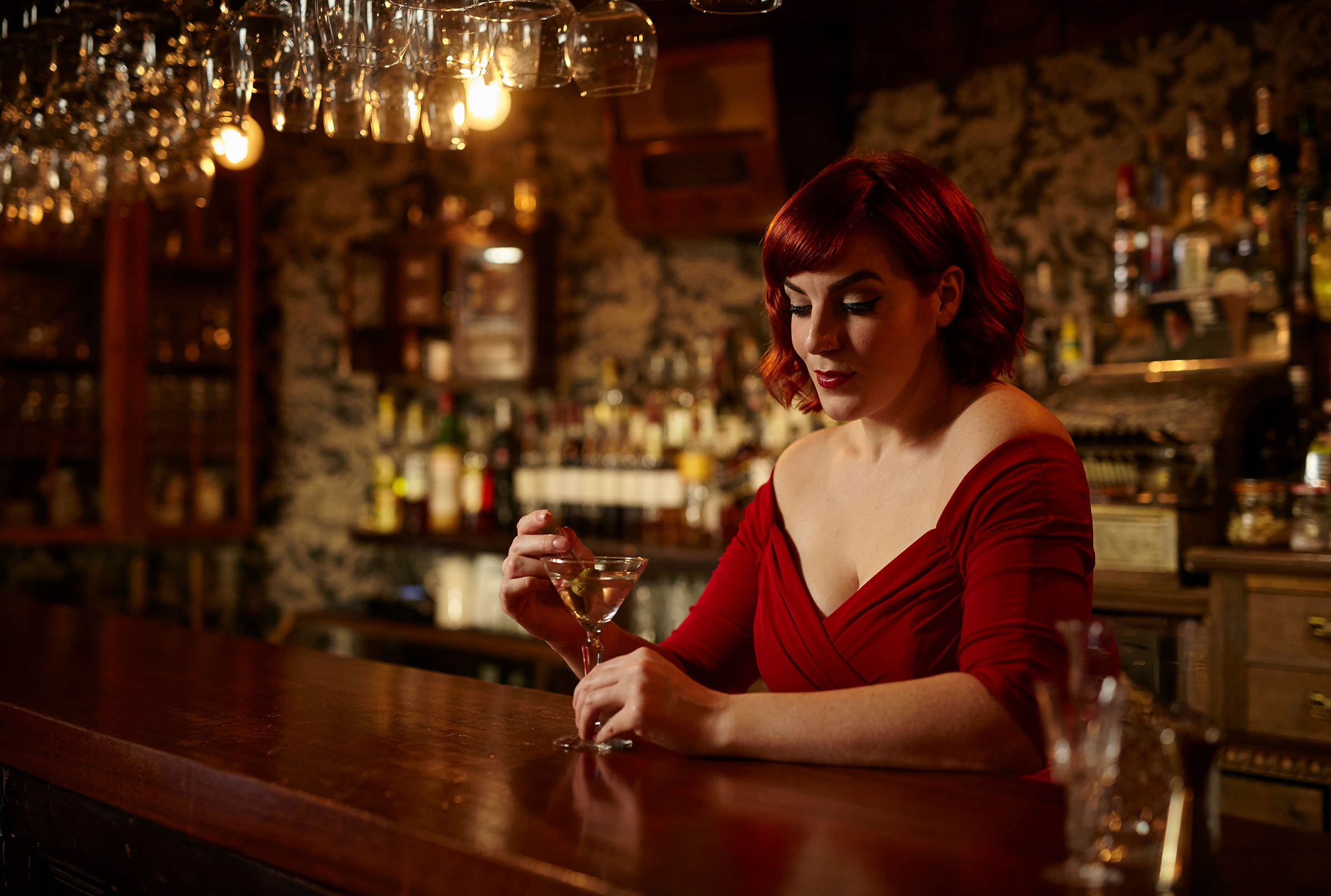 Jazz Singer Ruby Wilder enjoying a cocktail in a bar